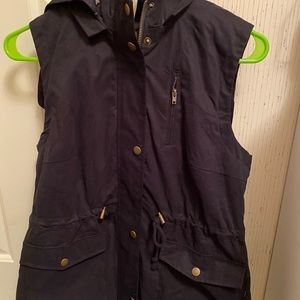 Black vest with removable hood and faux fur inside